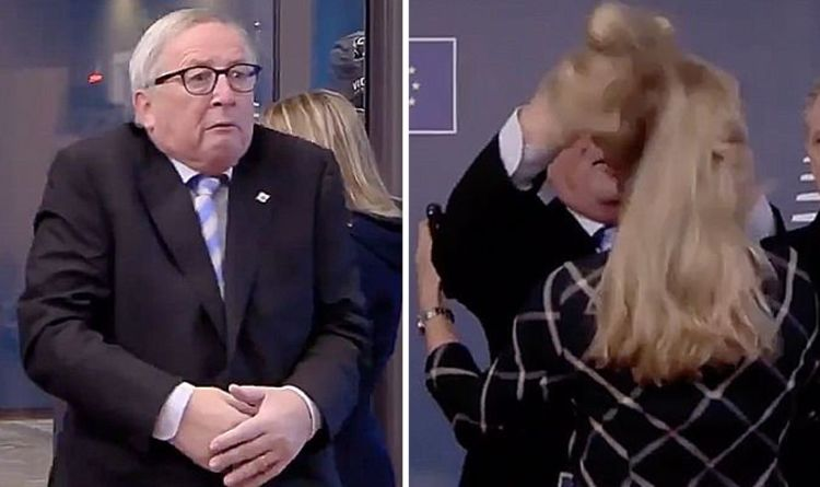(VIDEO) Juncker v Bruslju metal dokumente, ženski stresal lase, blokiral kamero… Spet kriv išias?